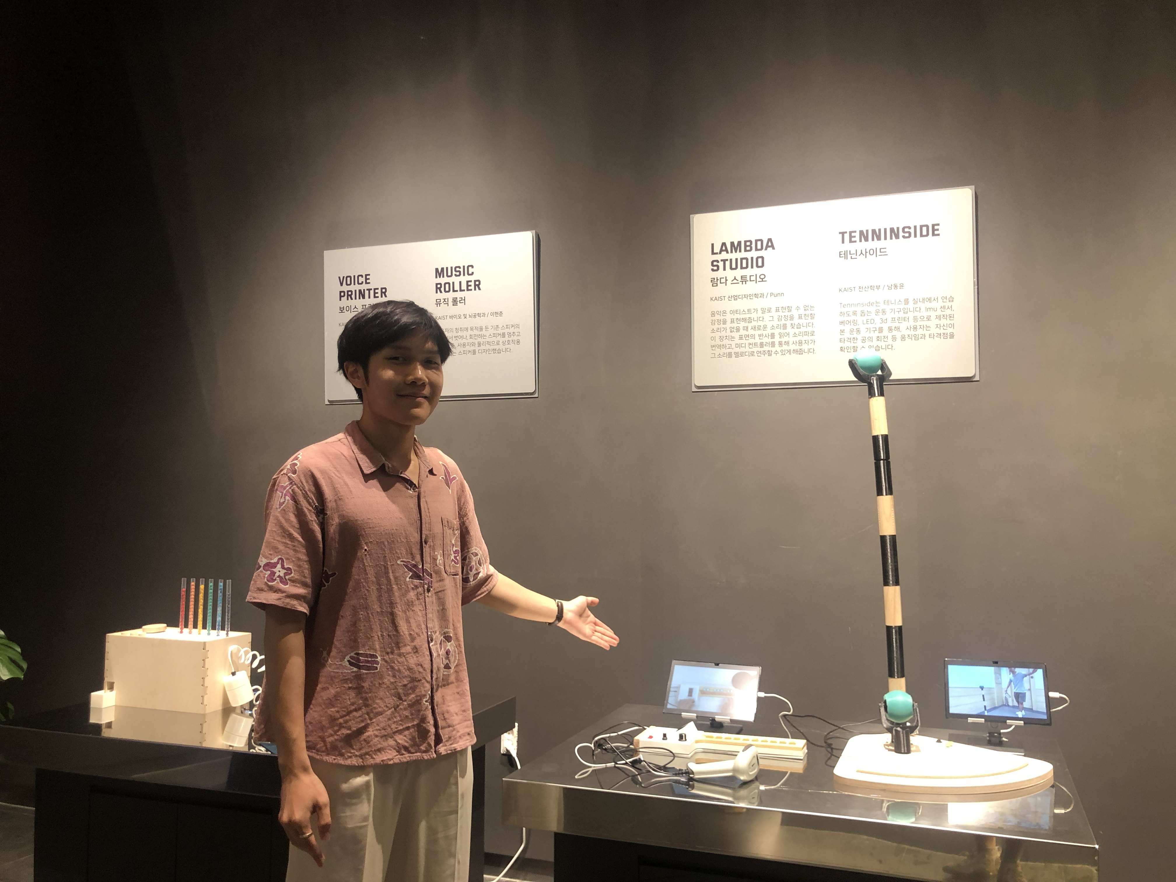Visitors interacting with the furniture at the exhibition booth